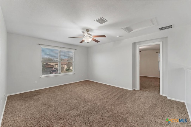 111 Sheep Trail Dr, Kyle, TX 78640 - unfurnished room featuring attic access, visible vents, carpet flooring, and baseboards