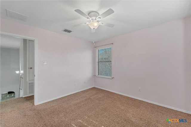 111 Sheep Trail Dr, Kyle, TX 78640 - unfurnished room with visible vents, a ceiling fan, and carpet flooring