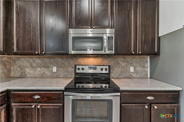 111 Sheep Trail Dr, Kyle, TX 78640 - kitchen featuring dark brown cabinetry, appliances with stainless steel finishes, and light countertops