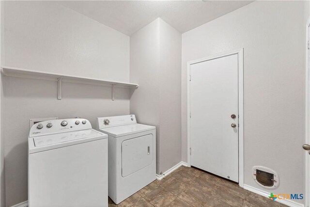 111 Sheep Trail Dr, Kyle, TX 78640 - laundry area with baseboards, laundry area, and washing machine and dryer