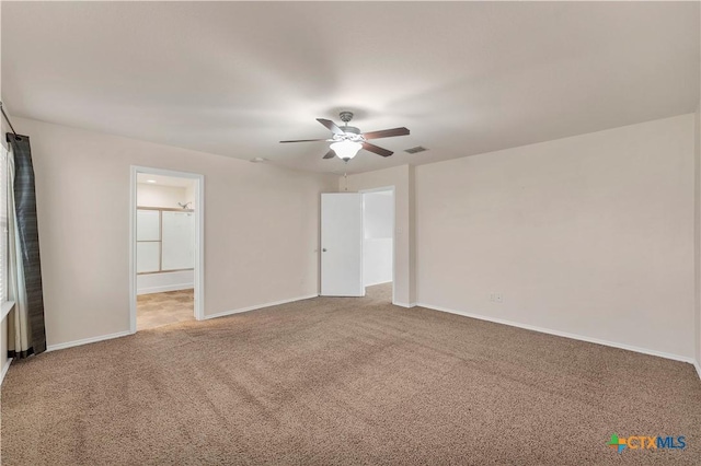 111 Sheep Trail Dr, Kyle, TX 78640 - carpeted empty room with a ceiling fan, visible vents, and baseboards