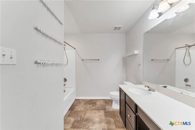 111 Sheep Trail Dr, Kyle, TX 78640 - bathroom with visible vents, baseboards, toilet, vanity, and bathtub / shower combination