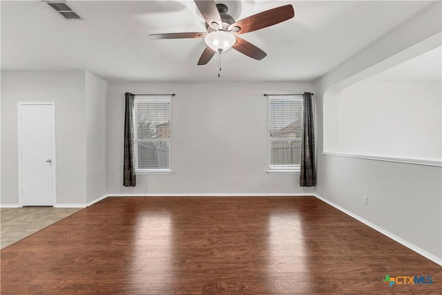 111 Sheep Trail Dr, Kyle, TX 78640 - empty room featuring baseboards, visible vents, wood finished floors, and ceiling fan
