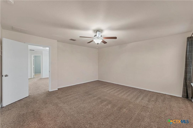 111 Sheep Trail Dr, Kyle, TX 78640 - unfurnished room featuring a ceiling fan, carpet flooring, baseboards, and visible vents