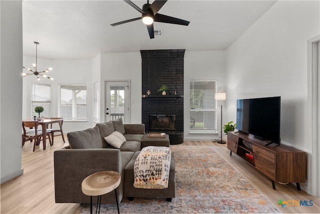 4810 Stone Pointe Dr, Temple, TX 76502 - living room with a chandelier, wood finished floors, ceiling fan, and plenty of natural light