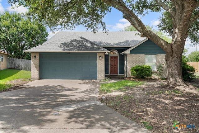 4810 Stone Pointe Dr, Temple, TX 76502 - single story home featuring brick siding, driveway, a garage, and a shingled roof