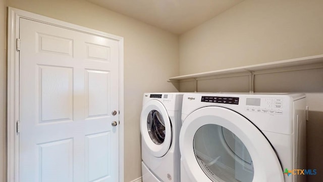 laundry room featuring washing machine and dryer