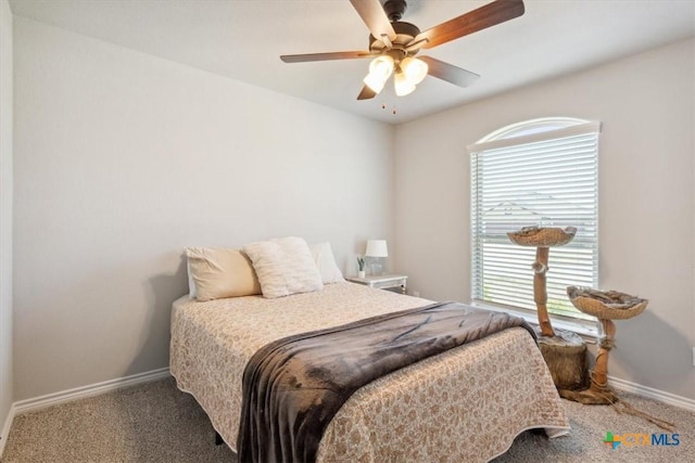 bedroom featuring ceiling fan, baseboards, and carpet floors