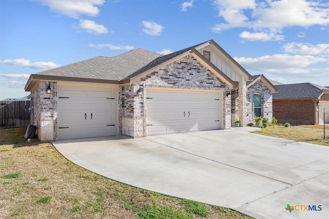 ranch-style house with driveway, fence, board and batten siding, a front yard, and a garage