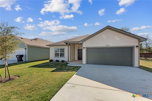 ranch-style home featuring a front lawn and a garage