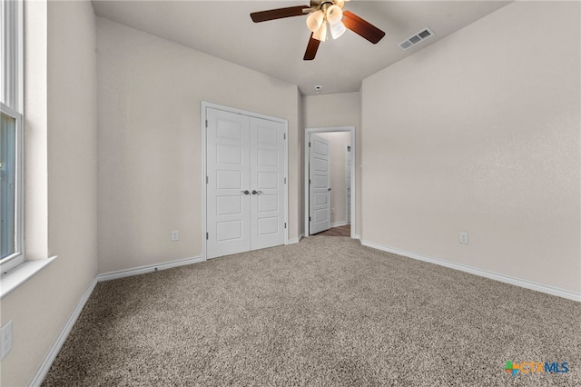 unfurnished bedroom with carpet flooring and ceiling fan