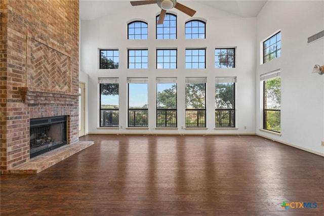 3614 Quail Hollow Rd, Harker Heights, TX 76548 - unfurnished living room with a ceiling fan, high vaulted ceiling, hardwood / wood-style flooring, and a brick fireplace