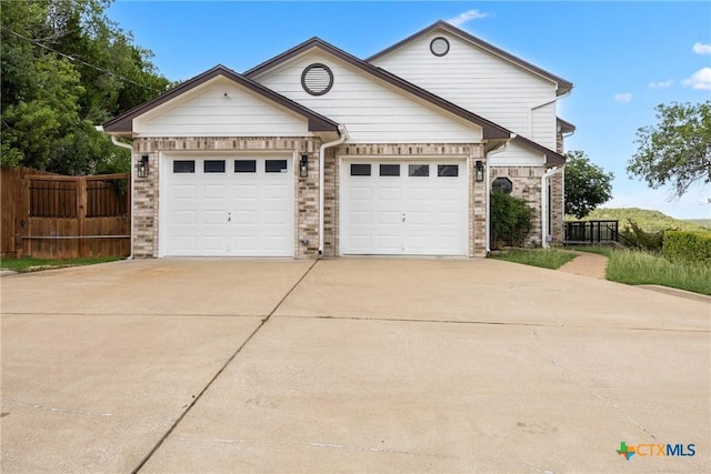 3614 Quail Hollow Rd, Harker Heights, TX 76548 - view of front of home featuring concrete driveway, an attached garage, and brick siding