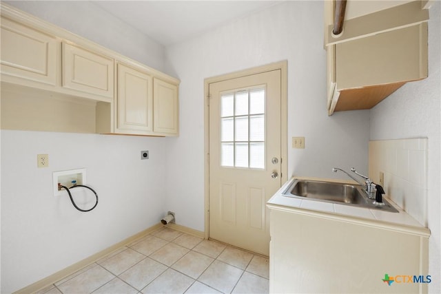 3614 Quail Hollow Rd, Harker Heights, TX 76548 - laundry room with hookup for a washing machine, hookup for an electric dryer, cabinet space, and light tile patterned floors
