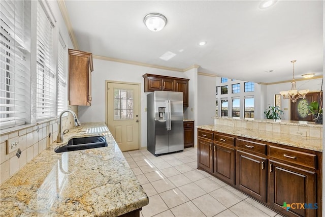 3614 Quail Hollow Rd, Harker Heights, TX 76548 - kitchen with stainless steel refrigerator with ice dispenser, backsplash, healthy amount of natural light, and crown molding