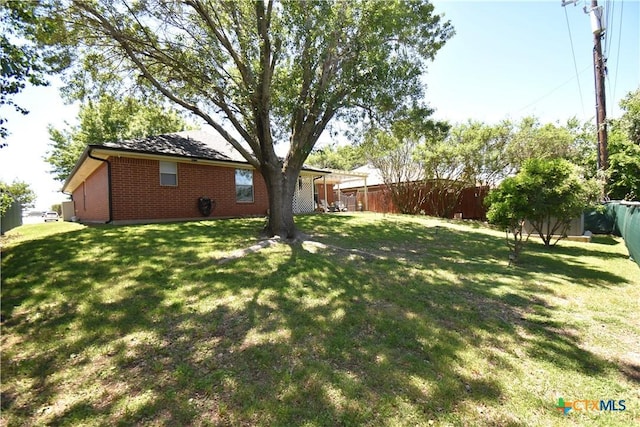 view of yard featuring a fenced backyard