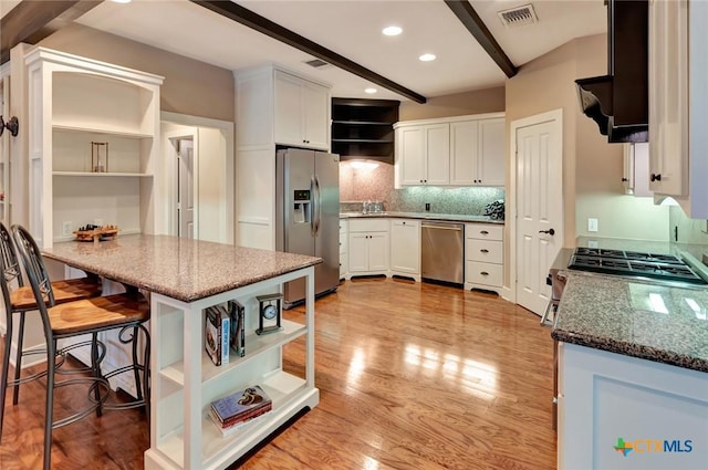 6 Cotswold Ln, Victoria, TX 77904 - kitchen with appliances with stainless steel finishes, open shelves, beam ceiling, white cabinetry, and light wood-type flooring
