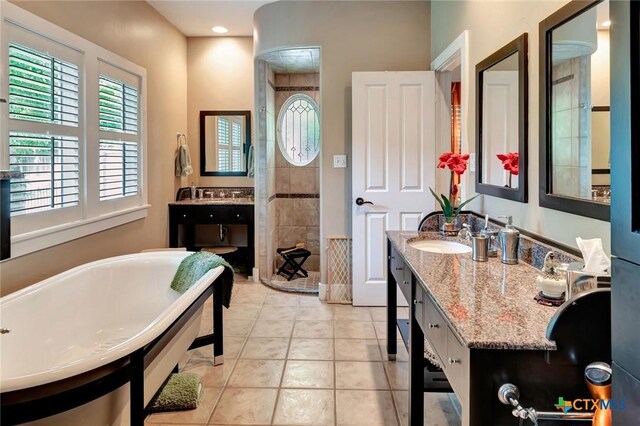 6 Cotswold Ln, Victoria, TX 77904 - full bath with a freestanding bath, walk in shower, vanity, and tile patterned floors