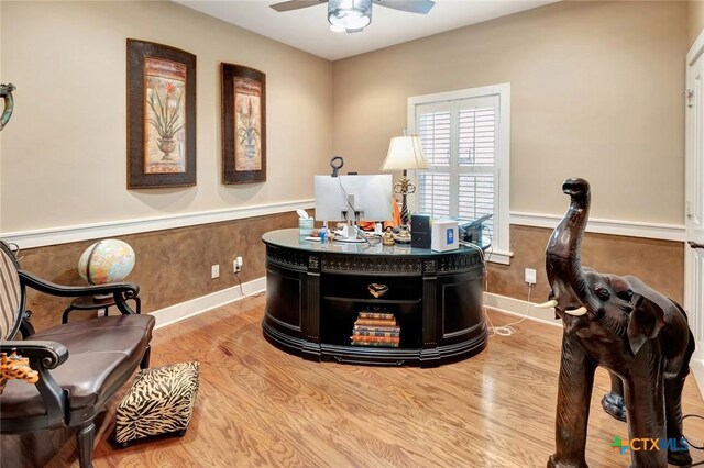 6 Cotswold Ln, Victoria, TX 77904 - office space with wainscoting, a ceiling fan, wood finished floors, and baseboards
