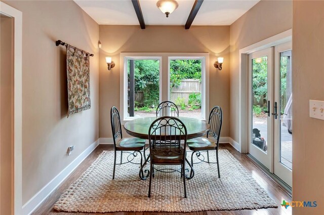 6 Cotswold Ln, Victoria, TX 77904 - dining space featuring beamed ceiling, french doors, baseboards, and wood finished floors