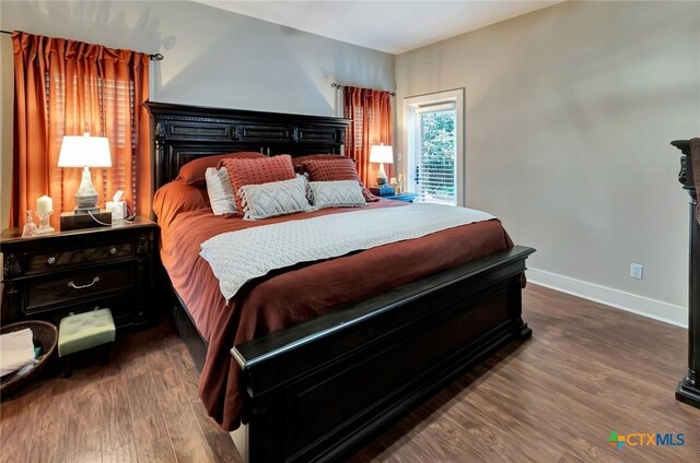 6 Cotswold Ln, Victoria, TX 77904 - bedroom featuring dark wood-style flooring and baseboards