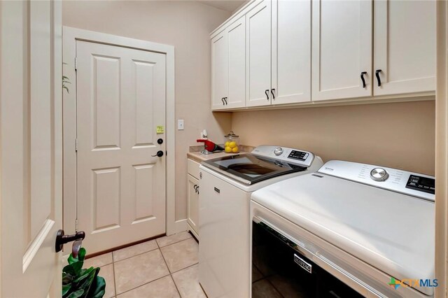 6 Cotswold Ln, Victoria, TX 77904 - laundry room with washer and dryer, cabinet space, and light tile patterned floors