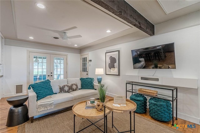 living room with beam ceiling, ceiling fan, french doors, and hardwood / wood-style floors