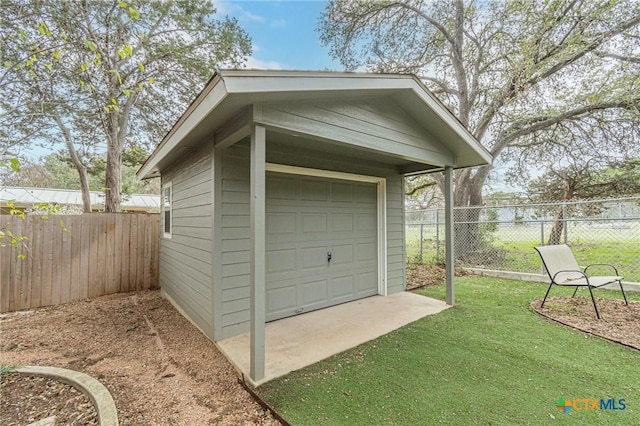 garage with a yard