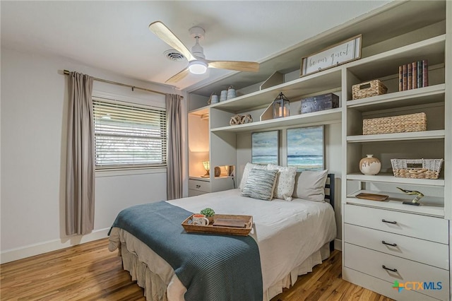 bedroom with ceiling fan and light hardwood / wood-style flooring