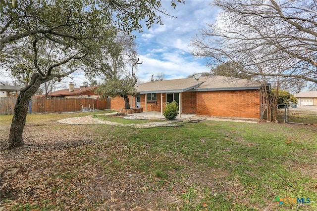 exterior space featuring a patio area and a front yard