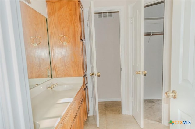 bathroom featuring vanity and tile patterned flooring