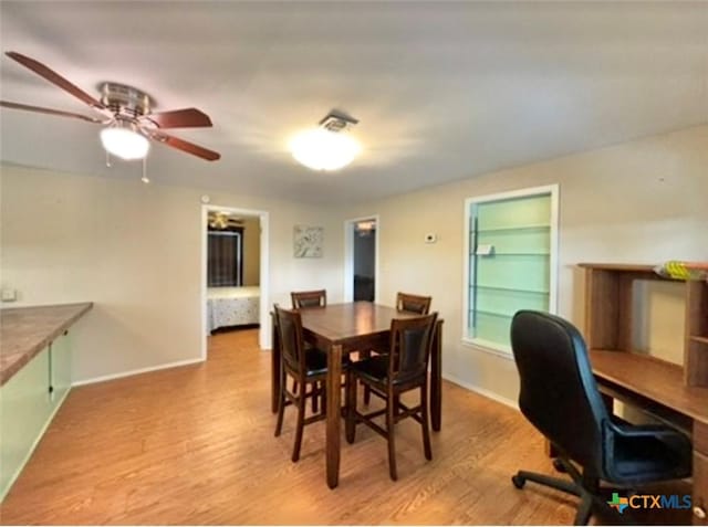 dining area featuring light hardwood / wood-style flooring and ceiling fan