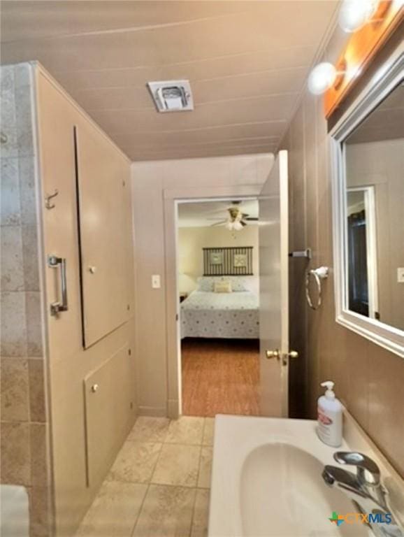 bathroom featuring sink, tile patterned floors, and ceiling fan