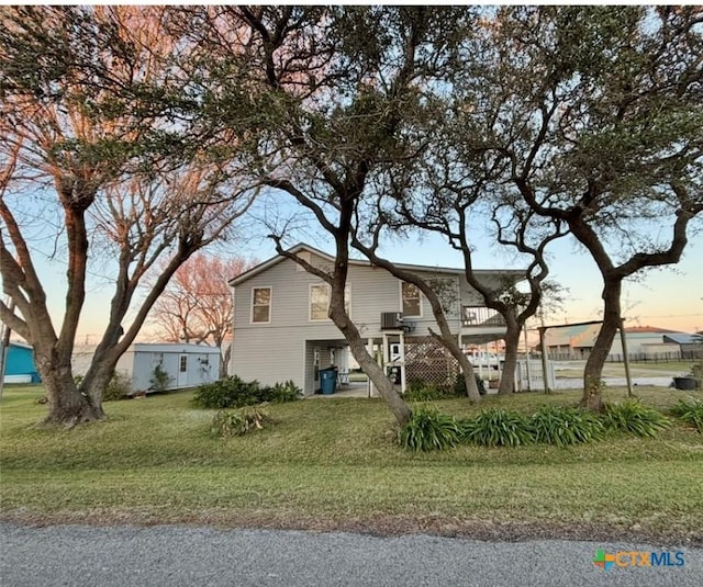 view of front of home with a yard