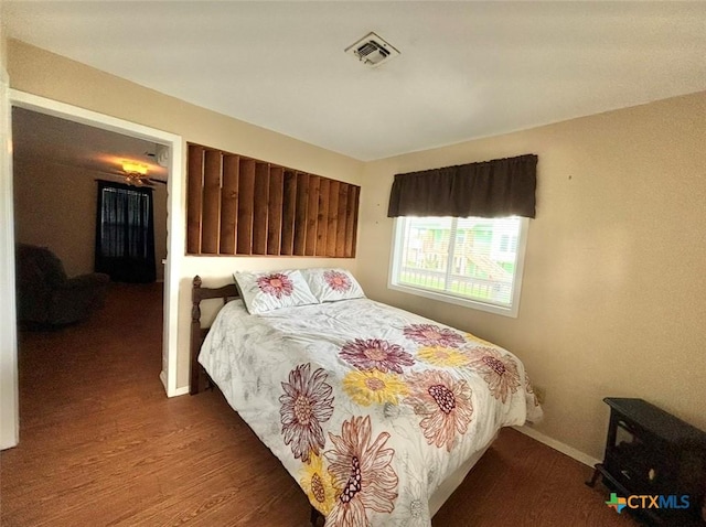 bedroom featuring dark wood-type flooring