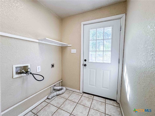 washroom with washer hookup, light tile patterned floors, and electric dryer hookup