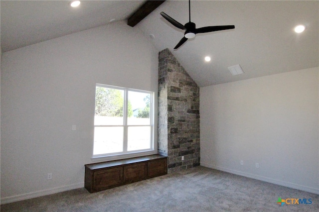 interior space featuring lofted ceiling with beams, ceiling fan, and light colored carpet