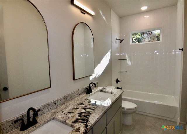 full bathroom with vanity, toilet, and tiled shower / bath