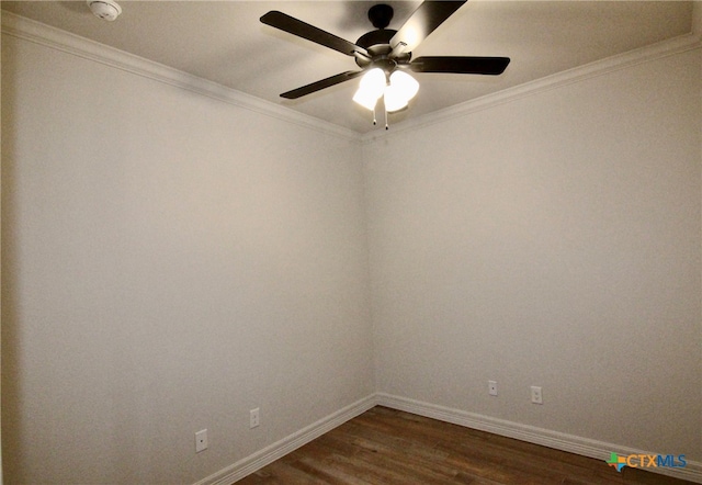 empty room featuring dark hardwood / wood-style flooring, ceiling fan, and ornamental molding