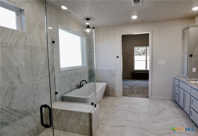 5715 Sparrow Ct, Temple, TX 76502 - full bath with a shower stall, a freestanding bath, vanity, and recessed lighting