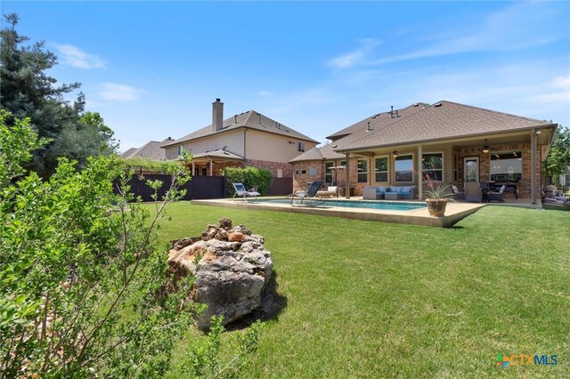 1919 Los Santos Dr, San Marcos, TX 78666 - back of house with a fenced in pool, a patio, brick siding, a fenced backyard, and a lawn