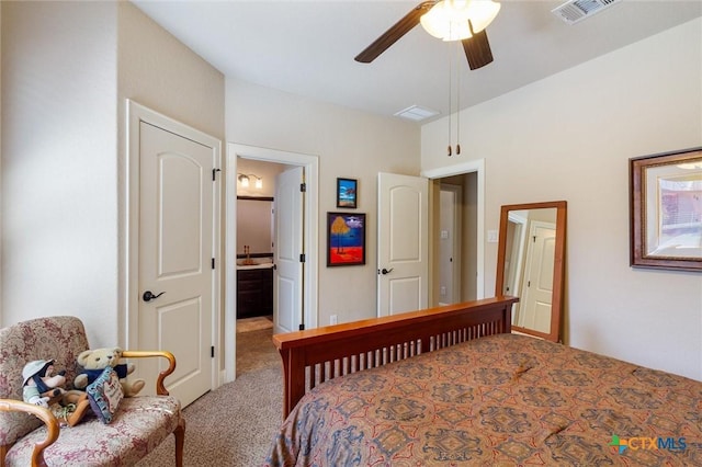 1919 Los Santos Dr, San Marcos, TX 78666 - carpeted bedroom with ensuite bath, a ceiling fan, and visible vents