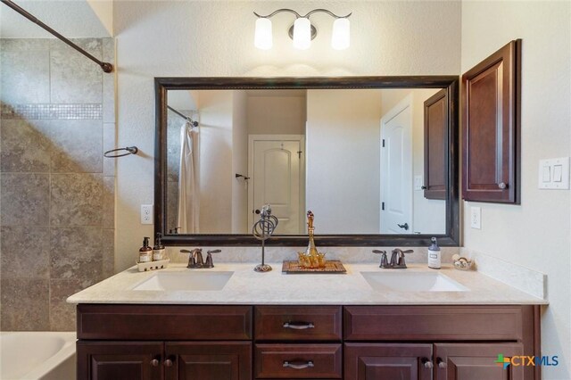 1919 Los Santos Dr, San Marcos, TX 78666 - bathroom with double vanity and a sink