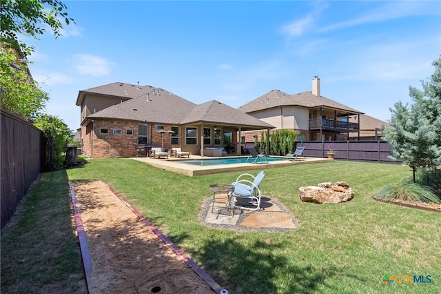 1919 Los Santos Dr, San Marcos, TX 78666 - back of house featuring a yard, a fenced backyard, a fenced in pool, and a patio