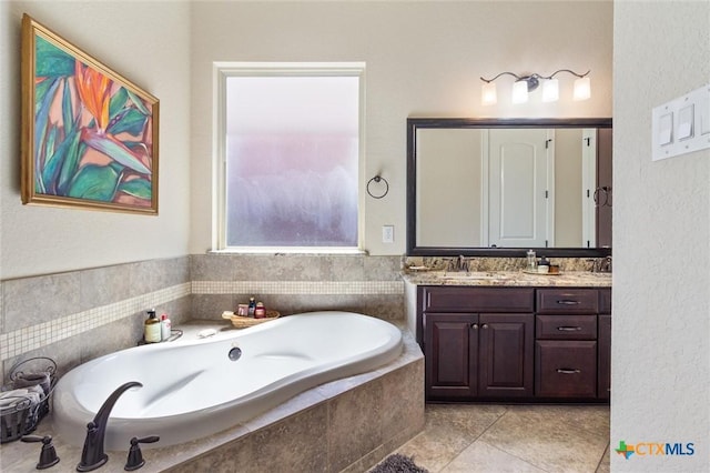 1919 Los Santos Dr, San Marcos, TX 78666 - full bathroom featuring tile patterned flooring, vanity, and a bath