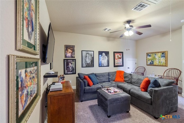 1919 Los Santos Dr, San Marcos, TX 78666 - carpeted living area with visible vents, baseboards, a ceiling fan, and attic access