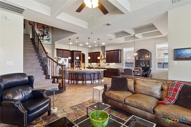 1919 Los Santos Dr, San Marcos, TX 78666 - living area featuring coffered ceiling, a ceiling fan, visible vents, and stairs