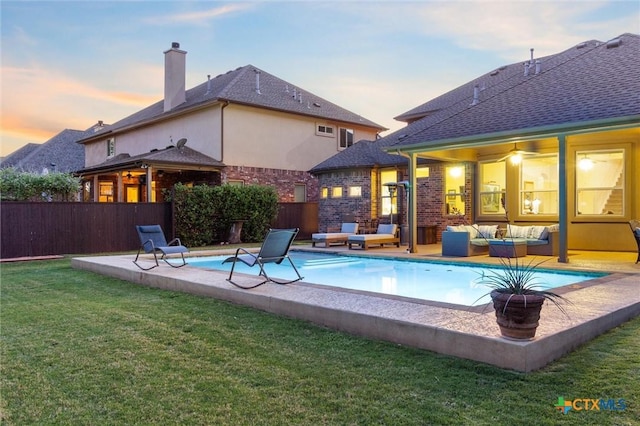 1919 Los Santos Dr, San Marcos, TX 78666 - rear view of house with an outdoor living space, a patio, a yard, and fence