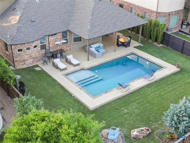 1919 Los Santos Dr, San Marcos, TX 78666 - view of swimming pool with outdoor lounge area, a yard, a fenced backyard, a patio, and a fenced in pool