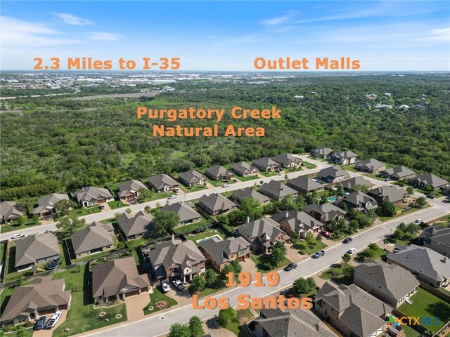 1919 Los Santos Dr, San Marcos, TX 78666 - drone / aerial view with a forest view and a residential view